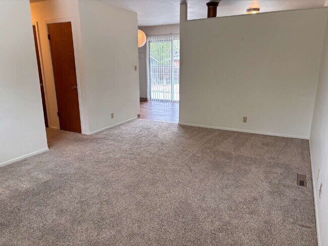 Building Photo - 3 BR bright, sunny, well-maintained house with large fenced yard and attached garage.