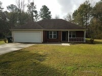 Building Photo - Spacious 3BR Brick Home with Open Split Floor Plan & Tiled Back Porch on Nearly an Acre