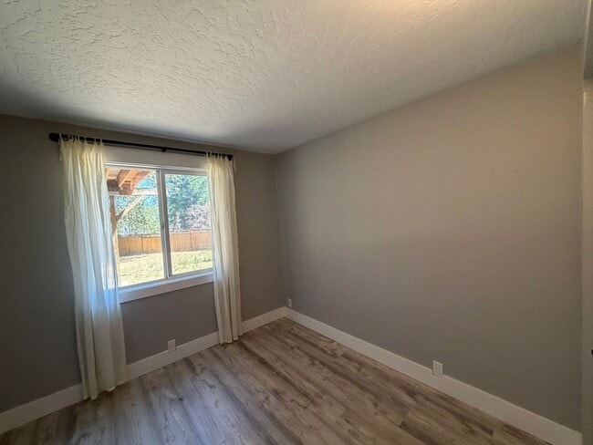 Building Photo - Spacious 4BR/3BA Home with Deck, Fenced Yard & Garage