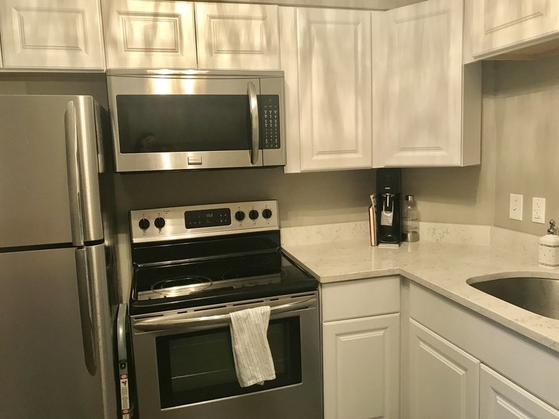 Renovated kitchen with quartz countertops. - 4426 Jarboe St