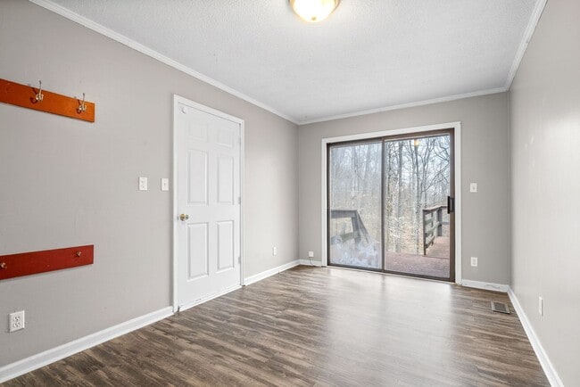 Building Photo - Lovely home on beautiful wooded corner lot