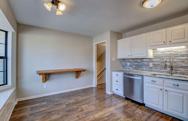 Building Photo - Welcome Home: Charming Brick Beauty with Covered Porch.