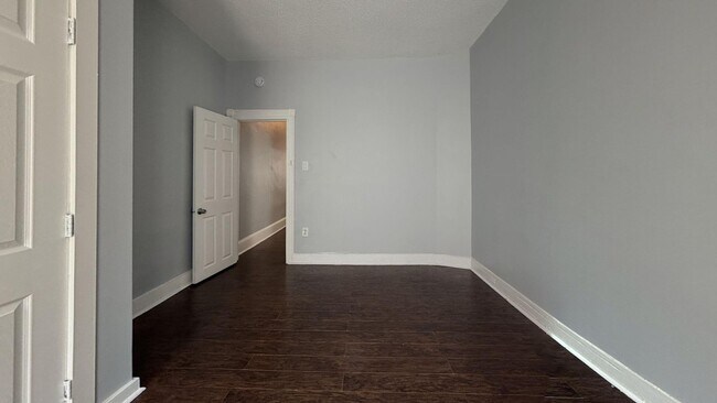 Building Photo - Updated 3 Bedroom 1.5 Bath Townhome w/ Paved Yard + Washer & Dryer