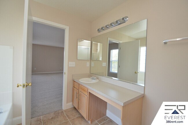 Building Photo - SPACIOUS, FULLY FENCED 4/2.5/2 IN DESIRABLE MATANZAS WOODS