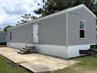 Building Photo - 2-Bed Mobile Home | Water, Trash & Lawn Care Included!
