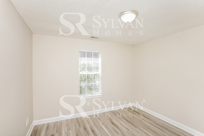 Building Photo - Welcome to this beautiful and sun-filled 3...