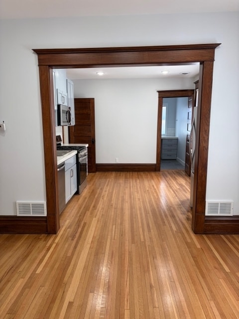 View from the living room into the kitchen. - 623 Pierce St NE