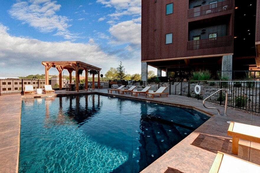 Unwind in luxury at Quarry Town Apartments, featuring a stunning pool and relaxing cabanas. Enjoy a vibrant community with modern amenities and breathtaking views. Schedule your tour today to find your ideal home! - Quarry Town Apartments