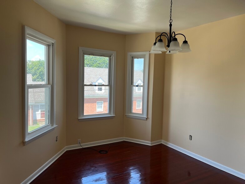 Dining room with hanging light fixture - 127 Peck Ave