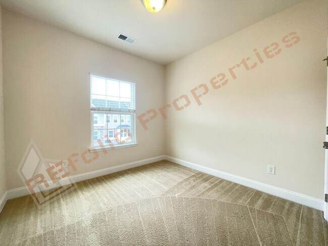 Building Photo - Beautiful 3 Story 3 Bedroom Townhouse with Huge 1st Floor Flex Space with Access to Patio + 2 Car...