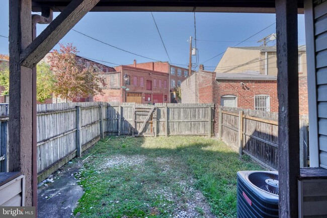 backyard, parking beyond gate - 682 Washington Blvd