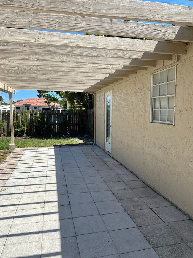 Building Photo - 2/2/1 home with a spacious fenced backyard...
