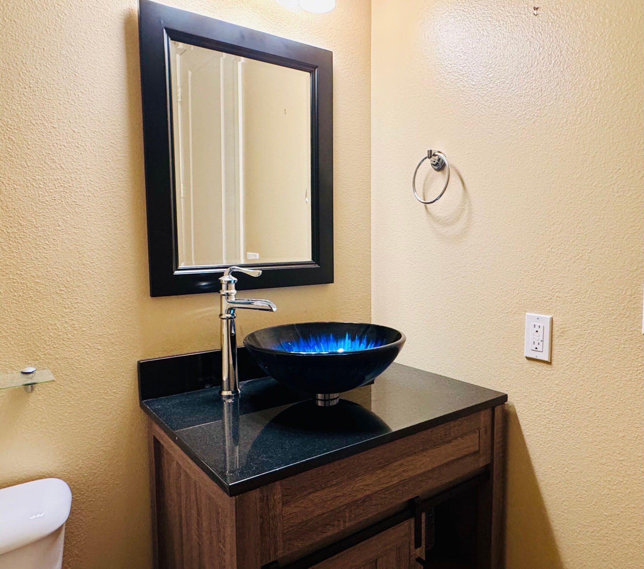Guest bathroom features a beautiful raised sink. - 13019 Park Pl