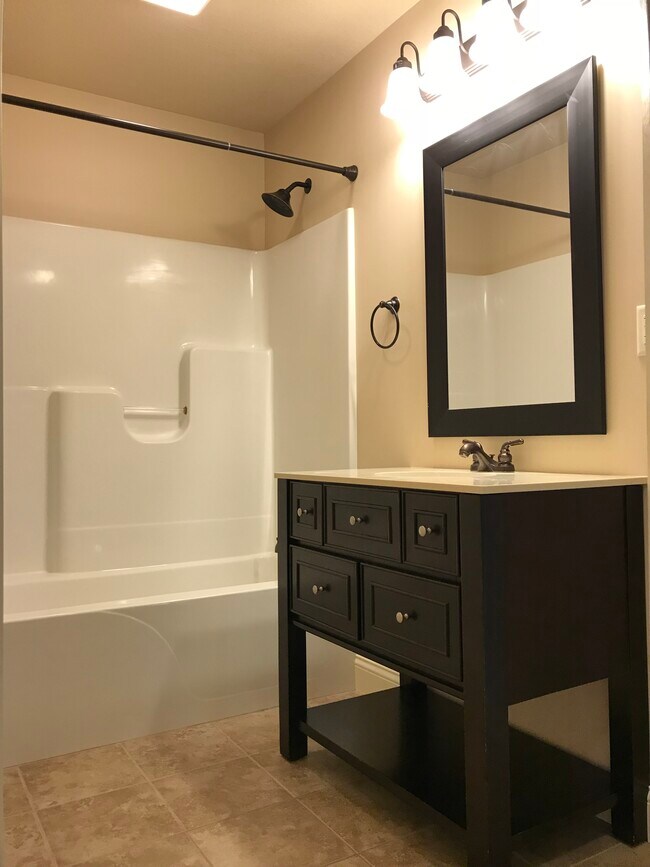 Master bathroom with tub/shower surround. - 110 Scenic Dr