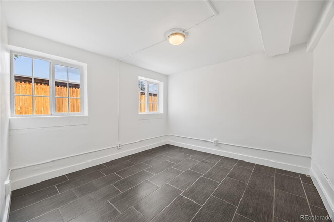 Building Photo - "Spacious 5-Bedroom Gem with Hardwood Floors & Cozy Fireplace in Denver's Heart!"