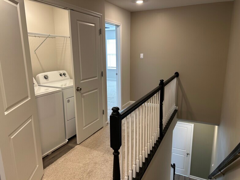 Upstairs & Laundry, looking into Primary Bedroom - 813 Bond St