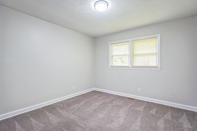 Building Photo - 4BR Brick Ranch with Upgrades & Room to Feel at Home!