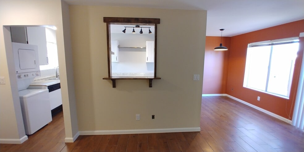 Pass through window connects the kitchen to the main living area. - 4423 Plaza Vista