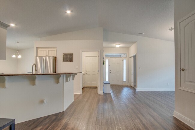 Building Photo - Spacious 4BR/2BA Brick Home with 2-Car Garage, Granite Kitchen, Vaulted Ceilings & Fully Fenced B...