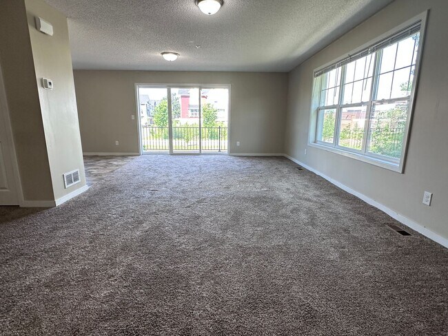 Building Photo - Champlin Corner Unit Town Home, 2 Car Garage, Dishwasher, Washer/Dryer, Balcony