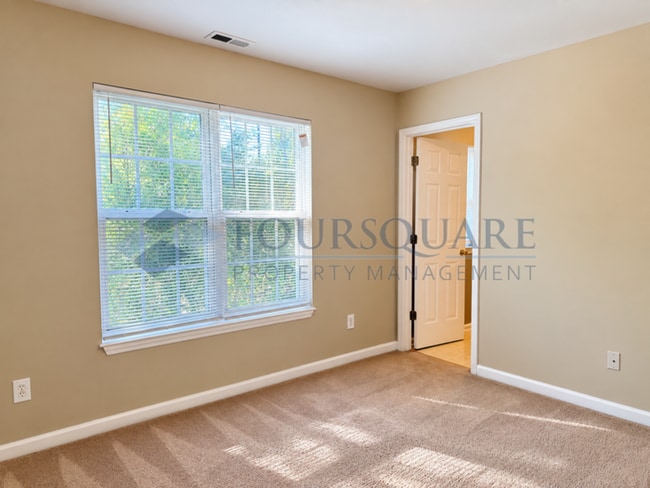 Building Photo - Inviting Townhome with En-Suite Secondary Bedroom, Back Patio & Community Pool – Raleigh Location