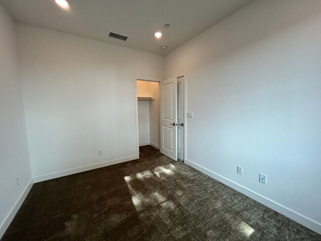 Building Photo - Gorgeous, 3 level townhome, featuring 2 car garage central Air, and in Unit laundry.