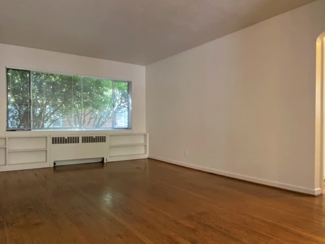 One Bedroom Living Room - Elite Court Apartments