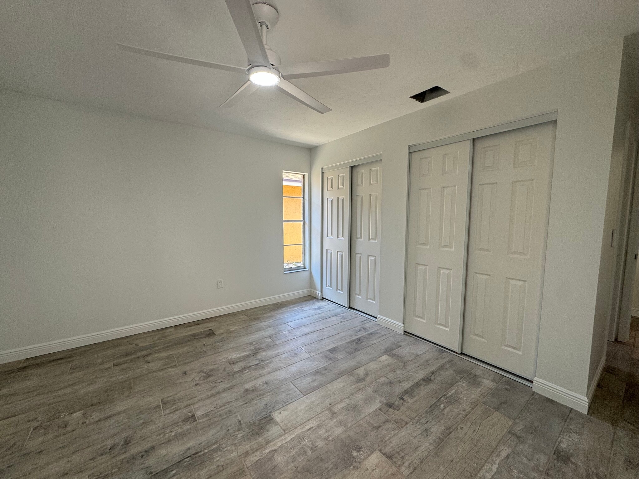 The main bedroom has a ceiling fan a roomy closet - 4142 Iola Dr