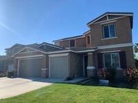 Building Photo - 4 Bedroom Home with Paid Solar, 3-Car Garage & Large Backyard