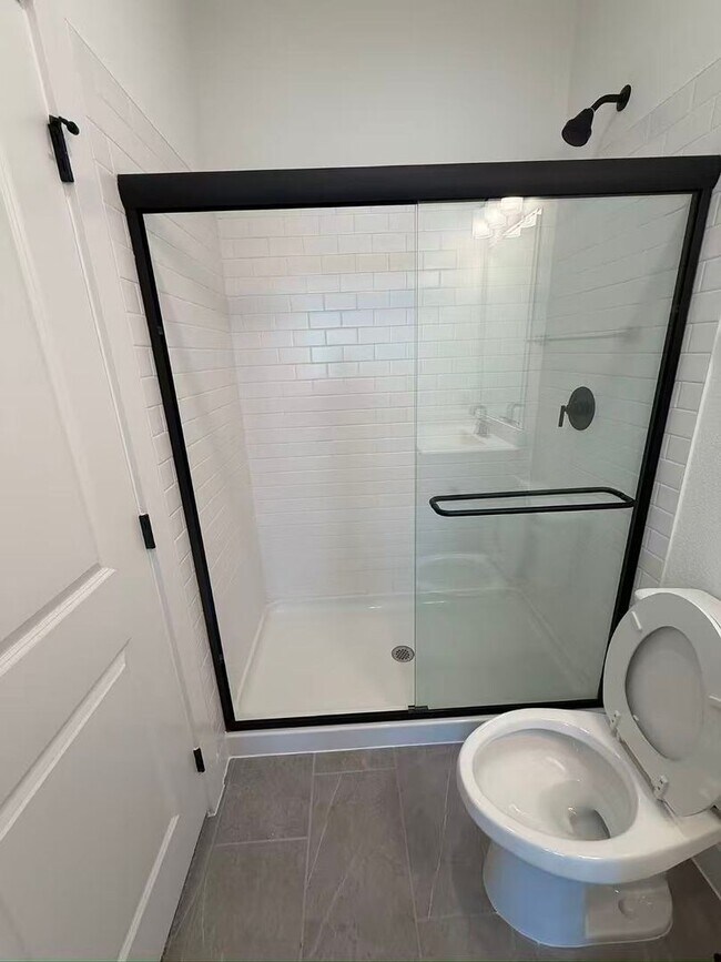 Building Photo - Move-in ready and like-new! Washer, dryer, and refrigerator Included.