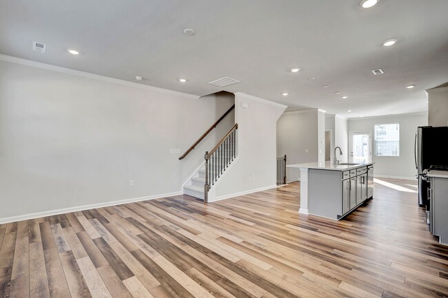 Building Photo - BRAND NEW BEAUTIFUL TOWNHOME IN GROWING AP...