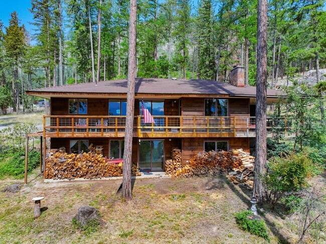 Building Photo - 2700 + sq ft family home has it all! Over 2 acres of land and a stunning view of Lake Pend Oreille