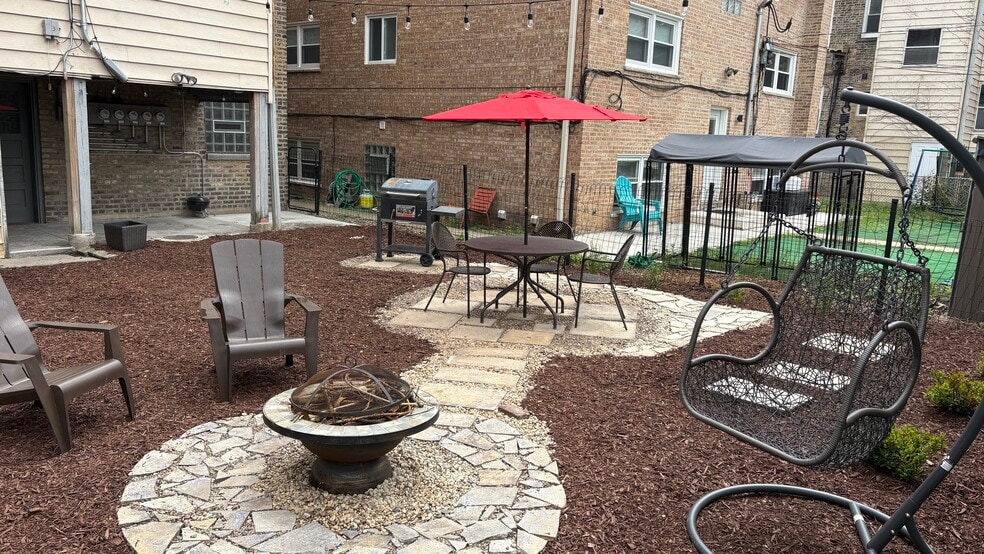 shared backyard w/ grill, fire pit, and furniture - 4036 N Mozart St
