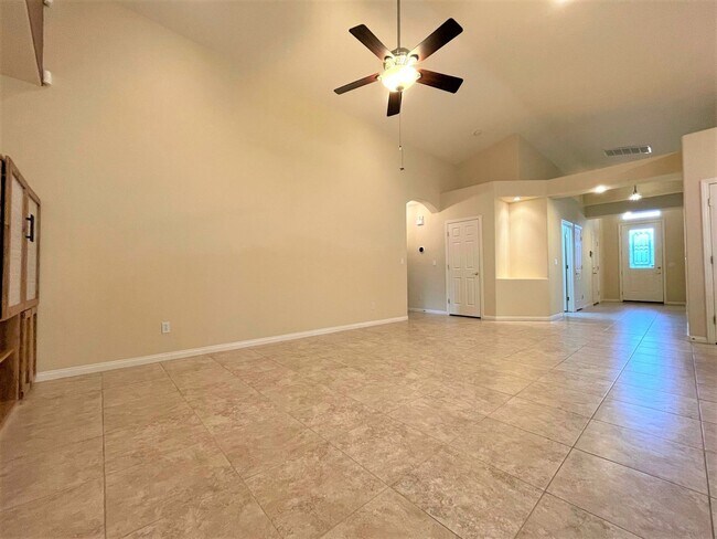 Building Photo - Vaulted Ceiling single-story home in a gat...