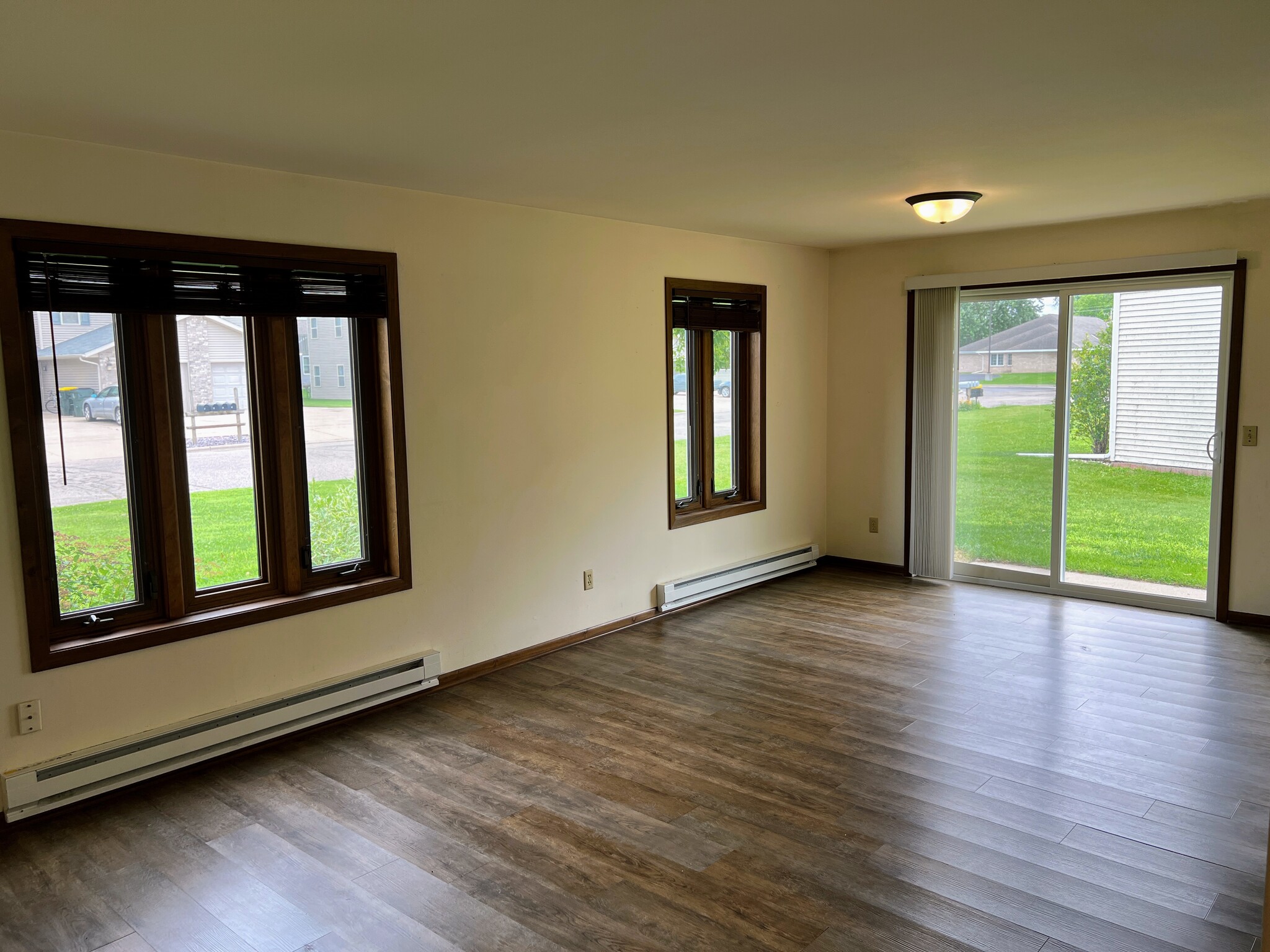 Living Room with Large Windows and Outdoor Views - 217 Ash Street