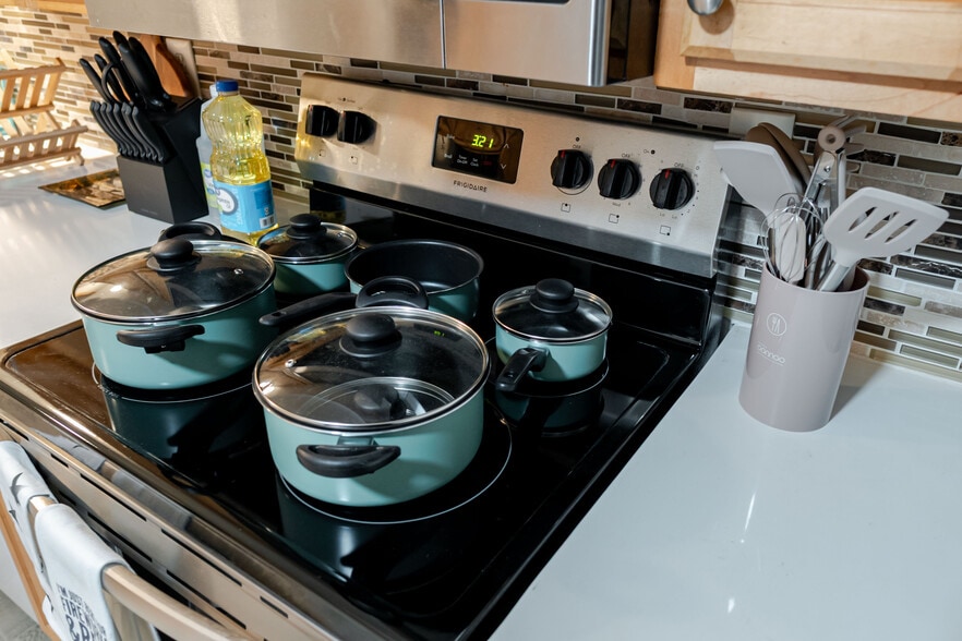 Fully equipped kitchen with a high-quality pan for all your cooking needs. - 4989 Randlett Dr