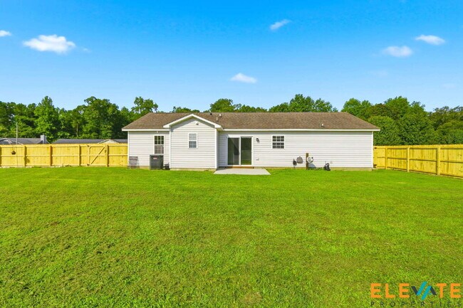 Building Photo - Beautiful Like-New 3 Bedroom Home with Huge Fenced Yard, Greenhouse & Storage