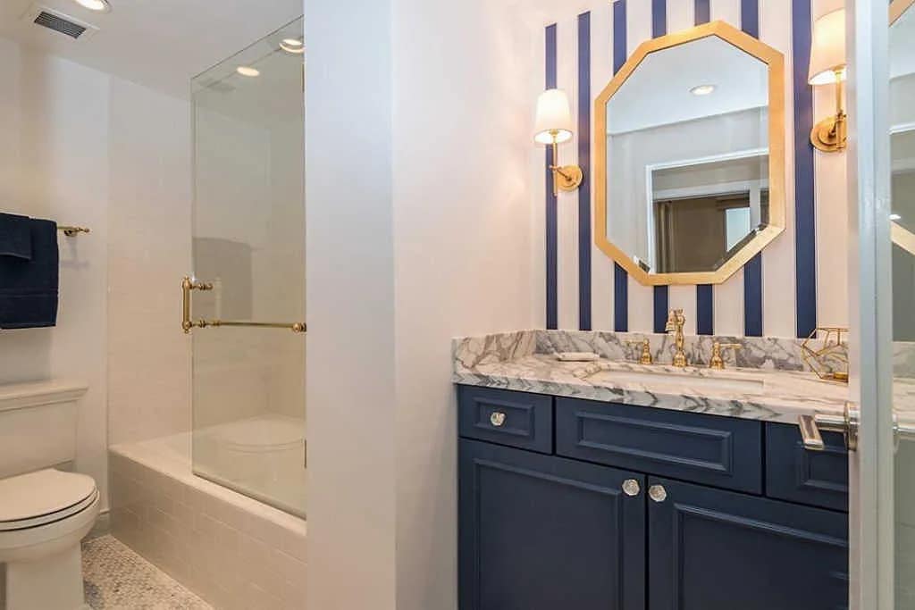 Guest Bathroom w/ Custom Cabinets and Marble Countertop - 10501 Wilshire Blvd