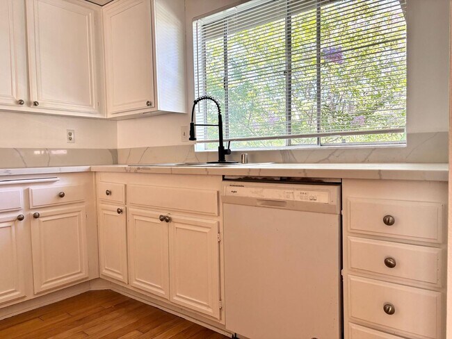 Building Photo - Available Now is a Condo style Townhouse i...