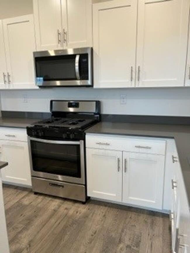 Building Photo - Brand new four bedroom, two and one half b...