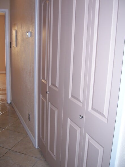 Laundry closet off hall, storage closet across. - 14519 Clovelly Wood