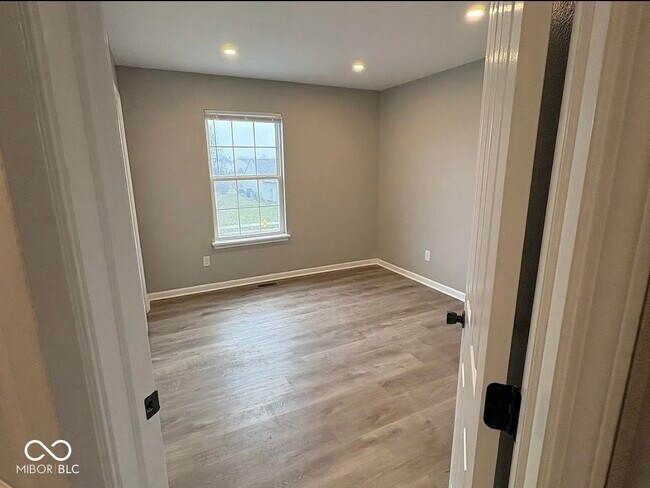 Building Photo - 6521 Rushing River