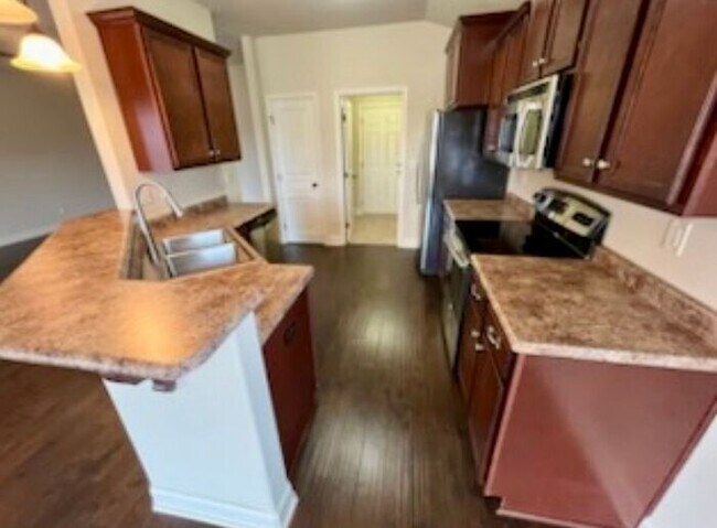 Building Photo - Settle In by the End of December—Apply Now!