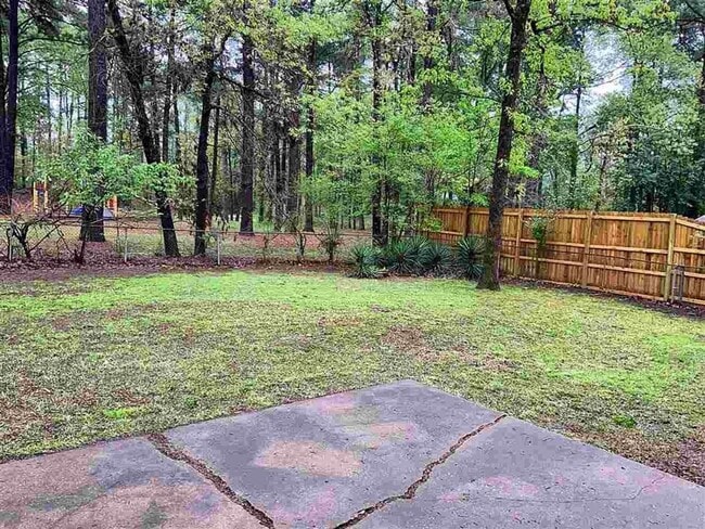 Building Photo - 3/2 with fenced yard and covered parking