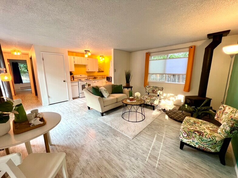 Living room and open kitchen and dining area. - 1614 Groves Ave NW