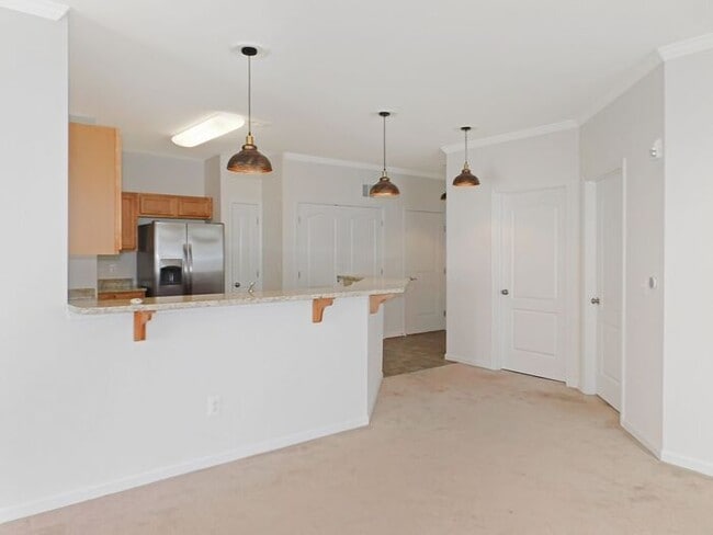 Building Photo - Pet Friendly Condo with Private Balcony and 1 Car Garage