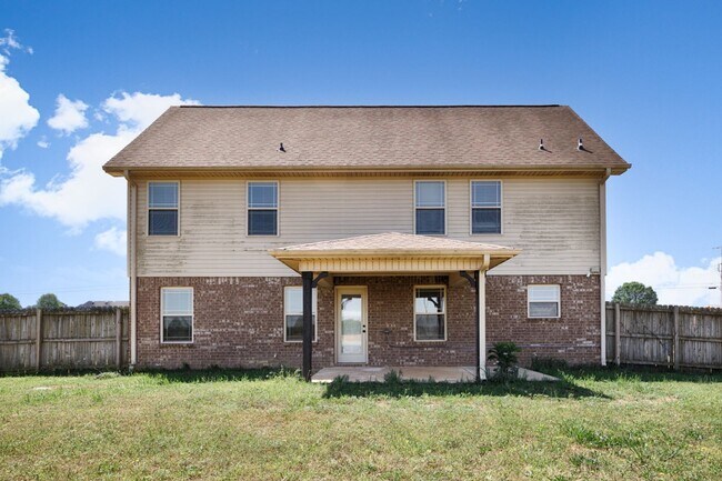 Building Photo - Fresh Paint & New Carpet! 4BR with Fenced Yard