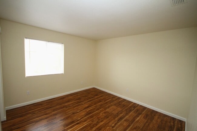 Building Photo - 4 Bed| 2.5 Bath | 2061 SF | 2 Car Garage | Long driveway with gate | Tenant pays $175 monthly for...