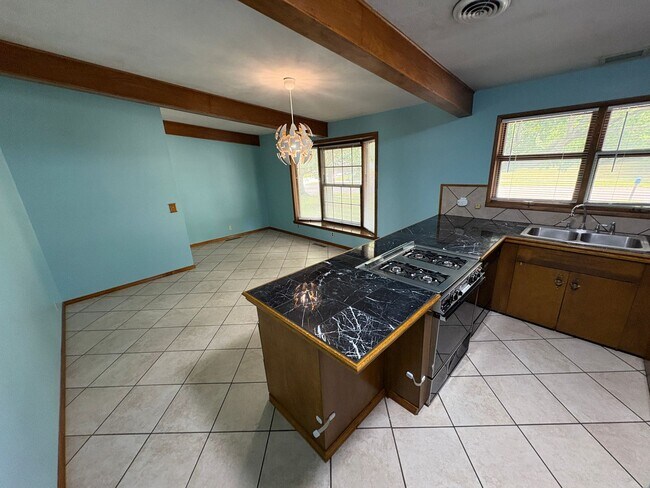 Building Photo - Spacious Home with Attached Garage & Fenced Backyard