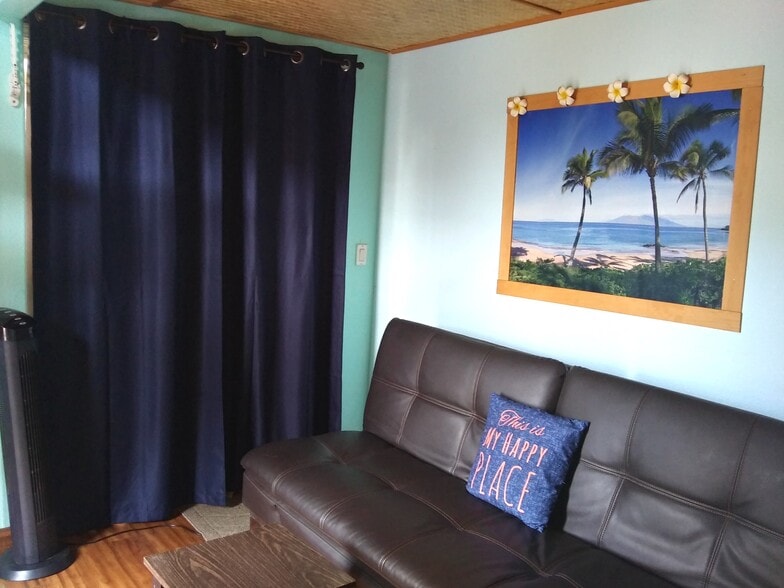 main floor Futon couch & UV curtains - 281 Kaikea St